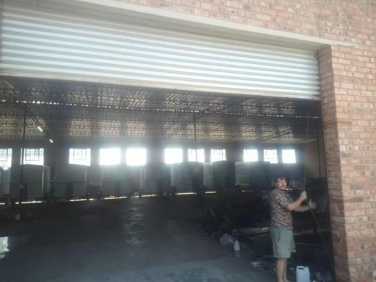 Industrial warehouse interior filled with rows of trailers